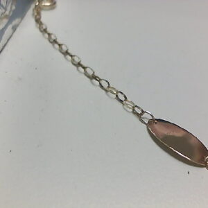 NMO O/A 9 KT ANILLAS Y PLACA OVAL